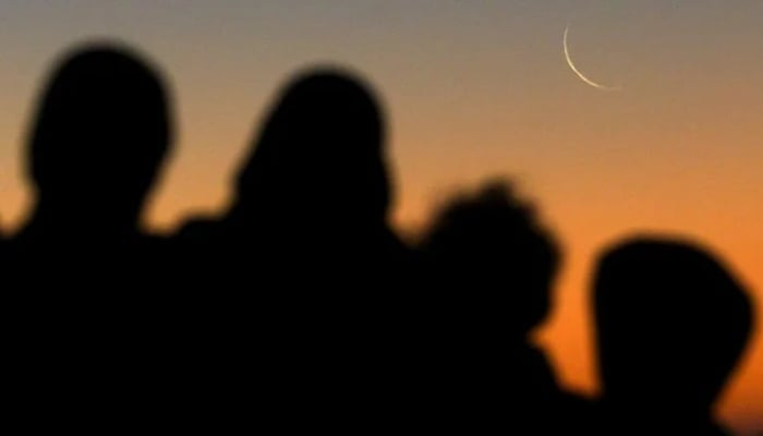 People sight moon in this undated image. — Reuters
