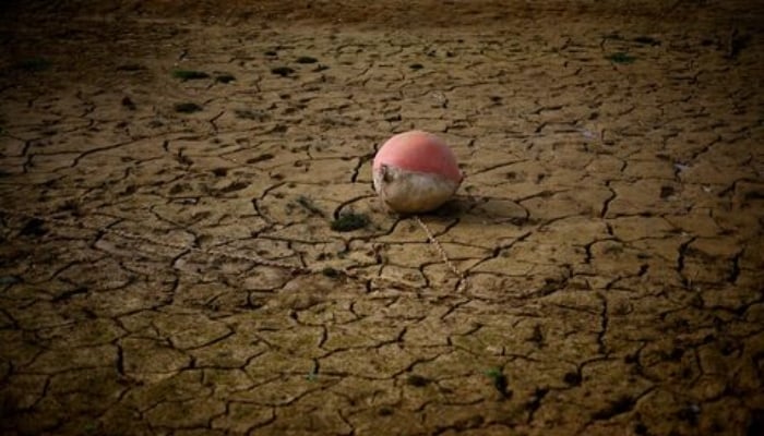 A buoy is seen on the banks of the partially dry Lake Montbel at the foot of the Pyrenees Mountains as France faces records winter dry spell raising fears of another summer of droughts and water restrictions, March 13, 2023. — Reuters