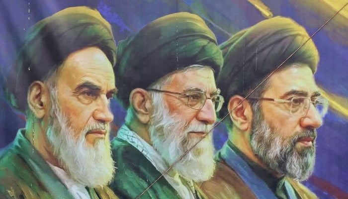 A banner featuring Irans late supreme leaders Ayatollah Ruhollah Khomeini (left) and Ayatollah Ali Khamenei (centre) next to newly elected supreme leader Ayatollah Mojtaba Khamenei, in Tehran on April 19, 2026. — AFP