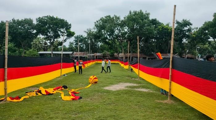 Bangladesh farmer unfurls vast Germany banner to show World Cup support