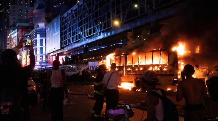 World Cup bus set alight as chaotic celebrations erupt in Manhattan after Knicks win