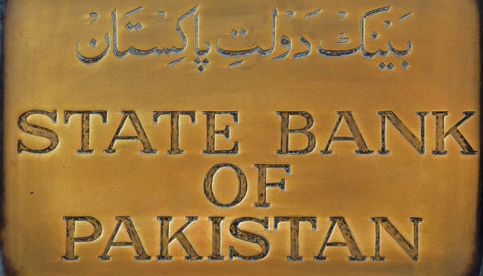 A brass plaque of the State Bank of Pakistan is seen outside its wall in Karachi, December 5, 2018. — Reuters