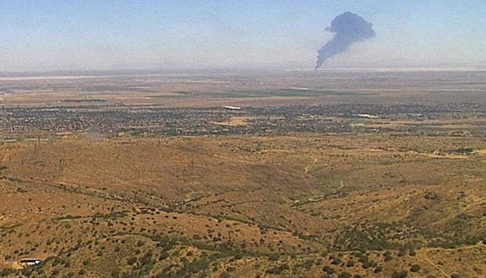 Smoke rises from Edwards Air Force Base after the crash of a US Air Force B-52 bomber aircraft in Edwards, California, US, June 15, 2026, in a still image from an ALERTCalifornia fire surveillance camera. — Rueters