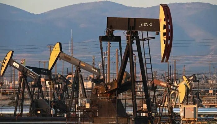Active pump jacks increase pressure to draw oil toward the surface at the South Belridge Oil Field on February 26, 2022, — AFP