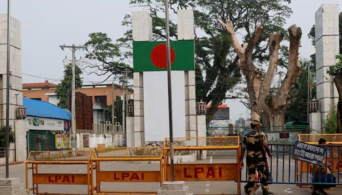 A Border Security Force (BSF) official stands in front of the gates of the India-Bangladesh international border in Petrapole, India, October 16, 2024. — Reuters