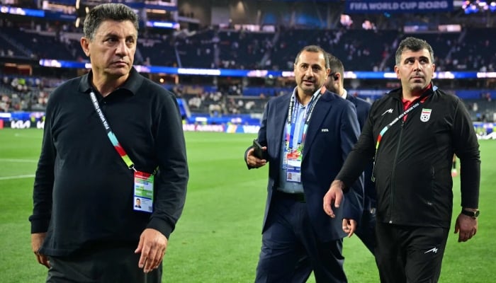 Irans head coach Amir Ghalenoei (left) walks off the pitch after the Fifa World Cup Group G match between Iran and New Zealand at Los Angeles Stadium in Inglewood, California, US, on June 15, 2026. — AFP