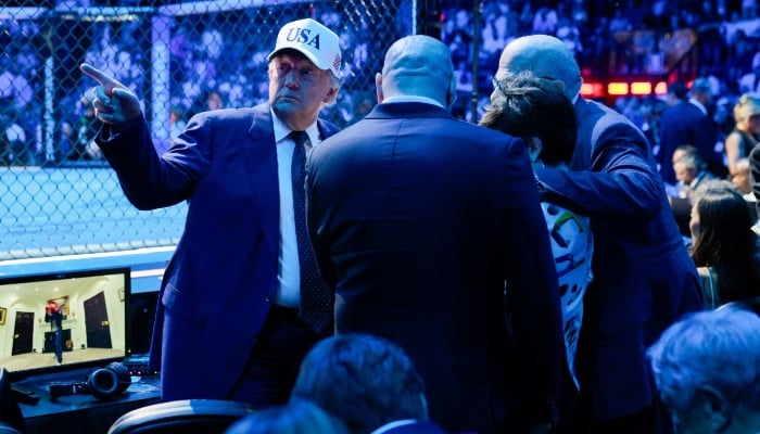 US President Donald Trump talks to guests during UFC Freedom 250 on the South Lawn of the White House in Washington, DC, US, June 15, 2026. — Reuters