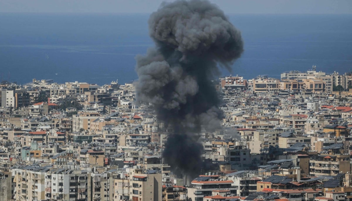 Hostilities continued as an image showing smoke rises from the site of an Israeli airstrike that targeted an area in Beiruts southern suburbs on March 11, 2026. — AFP