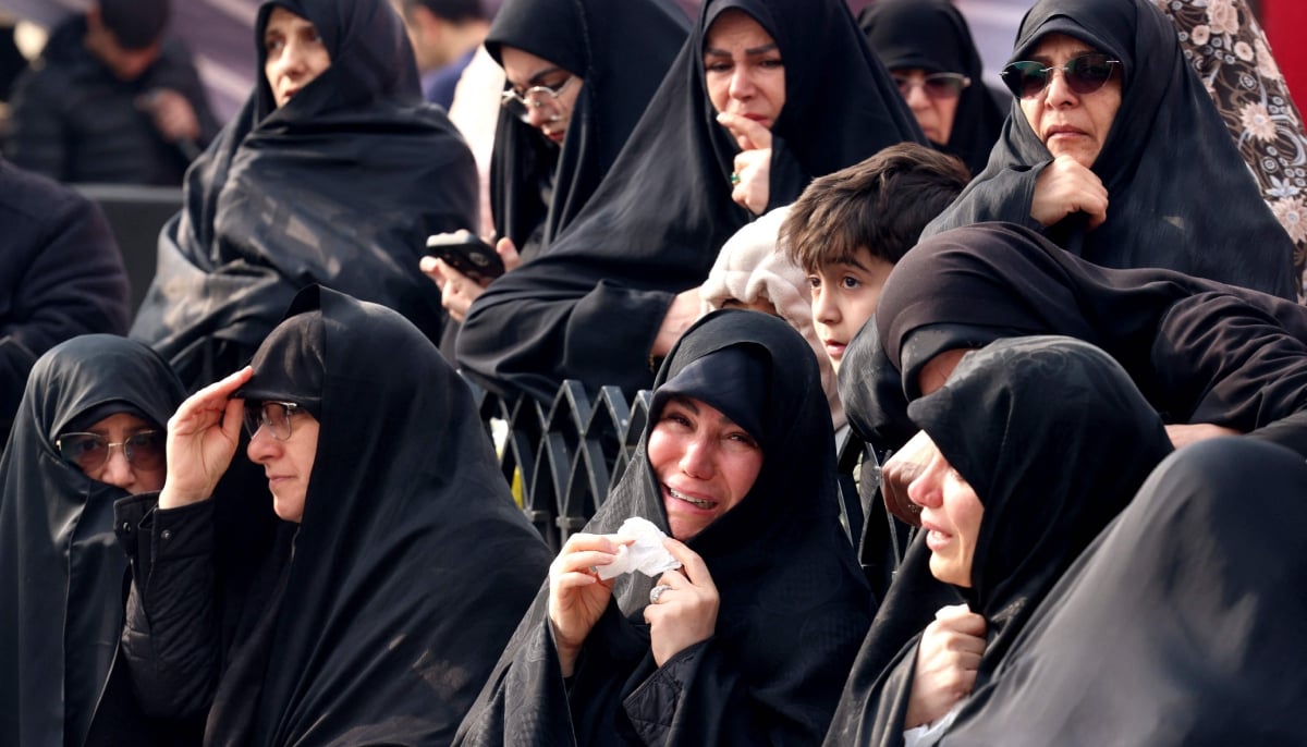 Family members and relatives of Ali Shamkhani, Iran´s slain influential security adviser, react during his funeral at the Imamzadeh Saleh shrine in Tajrish square in northern Tehran on March 14, 2026. — AFP