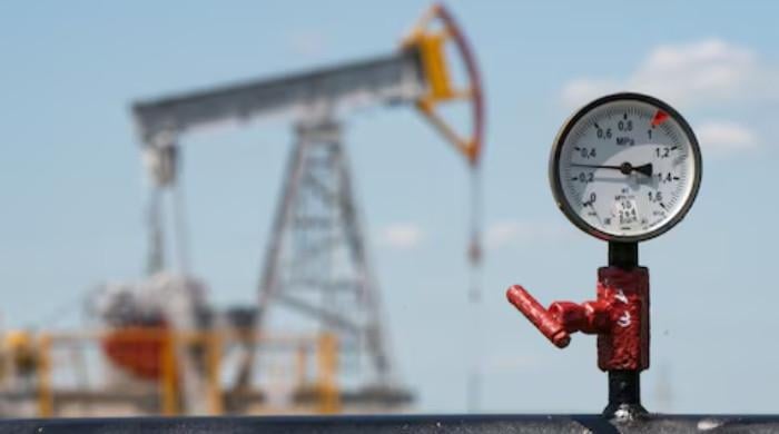 Oil slides on Iran supply prospects as traders wait on Warsh