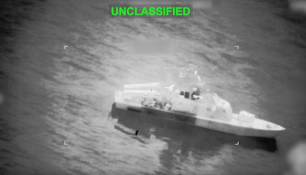 This screen grab obtained from video released by the US Central Command on their X account @CENTCOM on March 10, 2026 shows what they say is an Iranian naval vessel just before it is struck by a projectile near the Strait of Hormuz as part of Operation Epic Fury on March 10, 2026. — AFP