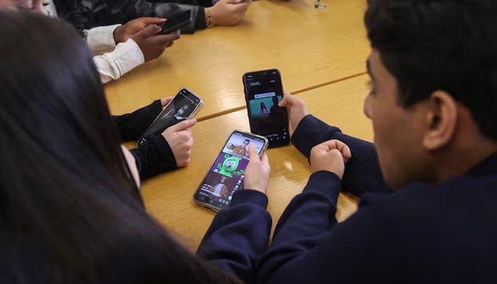 A representational image of teenagers using social media. — Reuters/File
