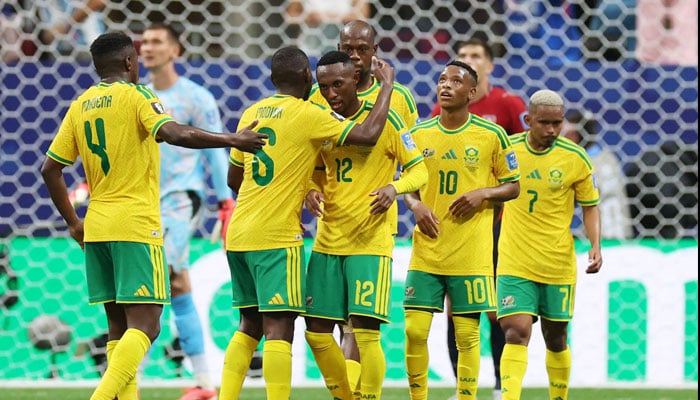 South Africas Thapelo Maseko celebrates with teammates after they are awarded a penalty for a handball by the Czech Republics Pavel  Sulc. — Reuters