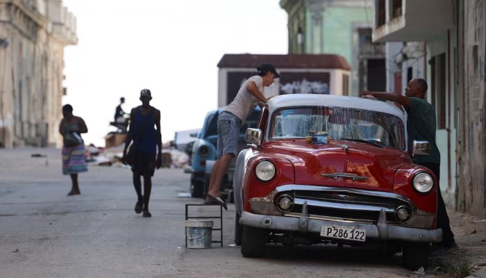 Cuban lawmakers approve sweeping reforms to socialist model amid US pressure 11 Men wash a vintage car on a street before the Cuban government presents far-reaching economic measures that could mark the most significant shift toward a market economy since the 1959 revolution, in Havana, Cuba, June 17, 2026. — Reuters