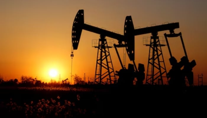 Pumpjacks are seen against the setting sun at the Daqing oil field in Heilongjiang province, China December 7, 2018. — Reuters