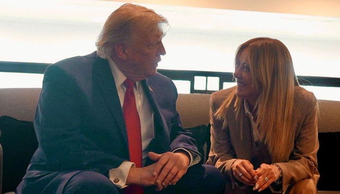 US President Donald Trump speaks to Italian Prime Minister Giorgia Meloni on the sidelines of the G7 Summit in Evian-les-Bains, France, June 17, 2026. — Reuters