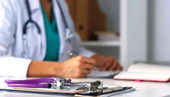 A representational image shows a doctor writing a prescription. — AFP/File
