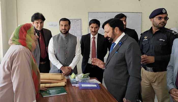 Gilgit-Baltistan Chief Election Commissioner Raja Shahbaz Khan, along with the District Returning Officer, visits various polling stations to review polling arrangements and ensure the smooth conduct of the election process. — APP/File