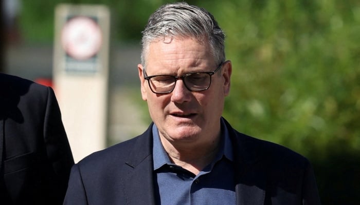 Britains Prime Minister Keir Starmer walks as he visits a housing development in north London, Britain, June 19, 2026. — Reuters