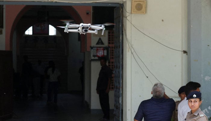 A police surveillance drone flies outside an examination center on the eve of NEET (National Eligibility cum Entrance Test) retest in Ahmedabad, India June 20, 2026. — Reuters