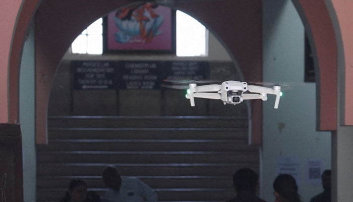 A police surveillance drone flies outside an examination center on the eve of NEET (National Eligibility cum Entrance Test) retest in Ahmedabad, India June 20, 2026. — Reuters