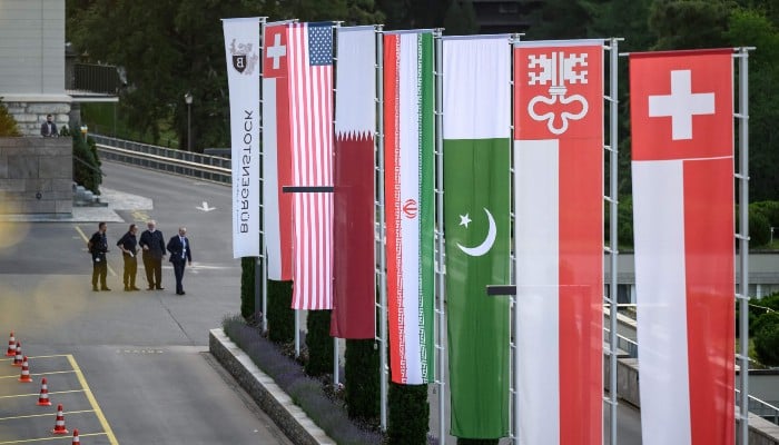 Flags of Switzerland, United States, Qatar, Pakistan and local Swiss canton of Nidwalden are photographed at the Burgenstock luxury hotel complex overlooking Lake Lucerne, Switzerland, on June 21, 2026. — AFP