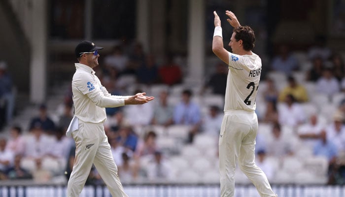 New Zealands Matt Henry celebrates with Tom Latham after taking the wicket of Englands Jordan Cox to win the match in the Second Test against New Zealand in Kia Oval, London, Britain on June 21, 2026. — Reuters