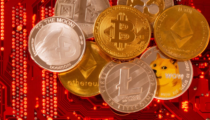 Representations of cryptocurrencies Bitcoin, Ethereum, DogeCoin, Ripple, Litecoin are placed on PC motherboard in this illustration taken, June 29, 2021. — Reuters