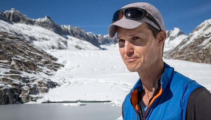 Glaciologist Matthias Huss standing next to the Rhone Glacier above Gletsch, in the Swiss Alps. — AFP