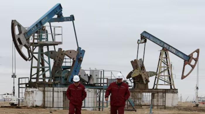 Oil inches down as investors focus on Hormuz flows after peace talks