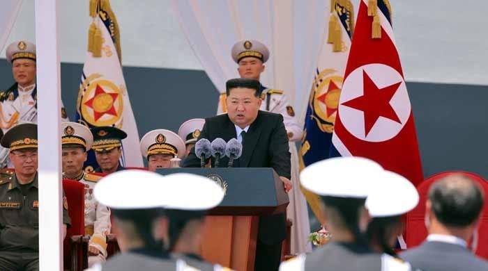 North Korea's Kim unveils plans for 10,000-tonne warships, nuclear navy