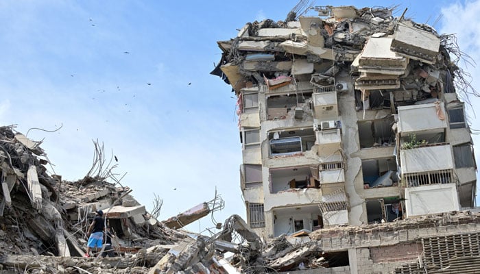 People search for casualties amid the rubble of collapsed buildings, in the aftermath of earthquakes in La Guaira, Venezuela, June 25, 2026. — Reuters