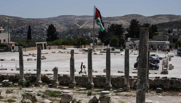 A Palestinian boy rides a scooter through archaeological remains in the ancient village of Sebastia, near Nablus in the Israeli-occupied West Bank, June 4, 2026.— Reuters/File