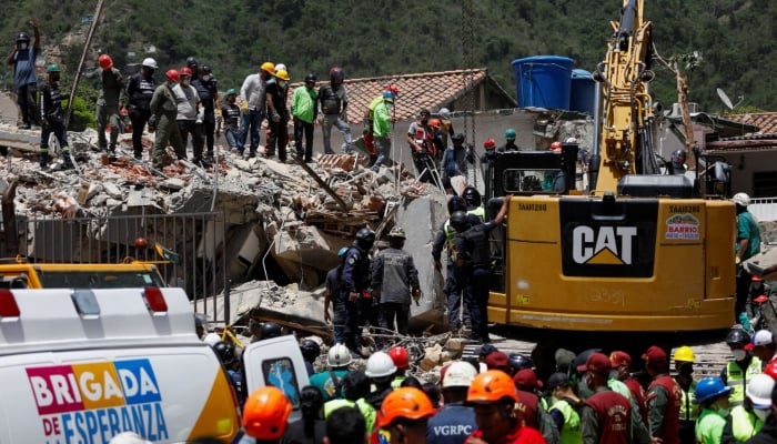 Emergency services work at the site of a collapsed building following earthquakes that hit the country, in Caracas, Venezuela, June 26, 2026. —  Reuters
