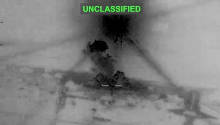 Smoke rises from explosions at an unknown location, following what US Central Command says were strikes on Iran in response to an Iranian drone strike on a cargo ship in the Strait of Hormuz, in this screen grab from video released June 26, 2026. — Reuters