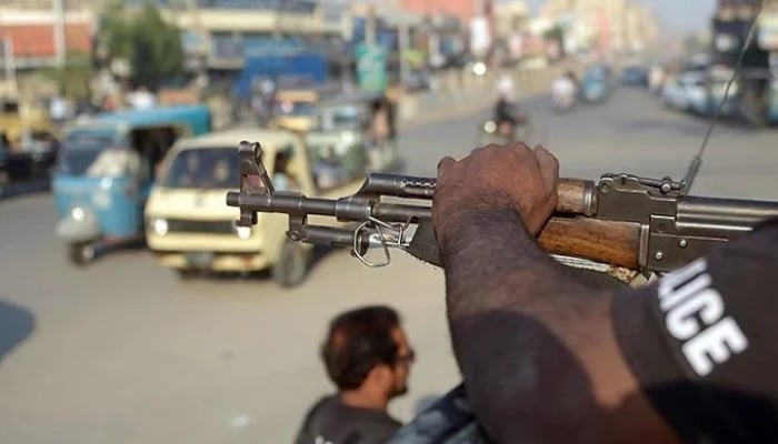 A policeman stands guard on a street in Karachi in this undated photo. — AFP/File
