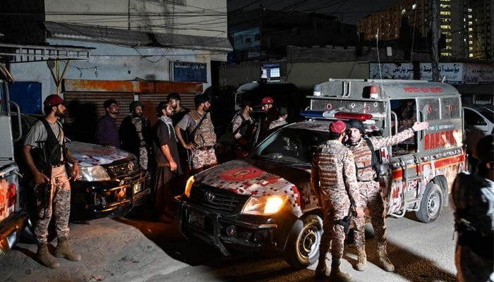 Paramilitary soldiers arrive to cordon off the streets around the Mosamiat Chowrangi area after a militant attack on Pakistans Security Rangers compound in Karachi, June 27, 2026. — AFP