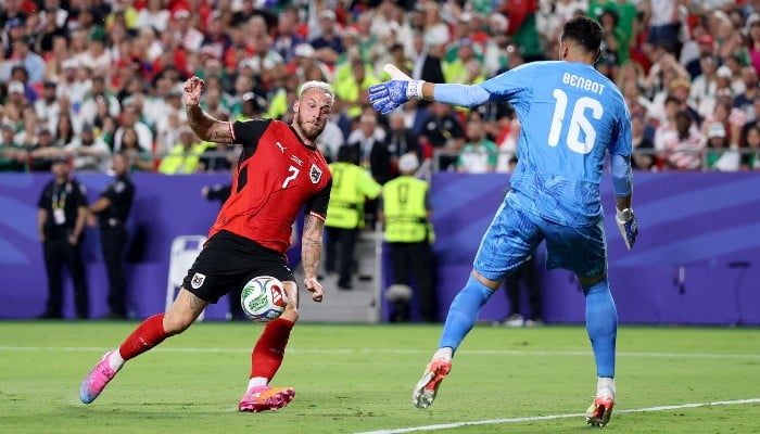 Austria draw with Algeria in World Cup thriller to progress and send Iran home
