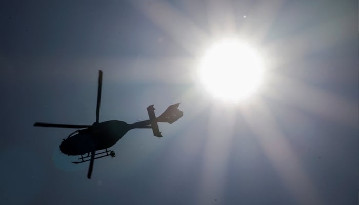 A police helicopter flies near the Buergenstock Resort, after US and Iran concluded high-level talks, in Stansstad, Switzerland, June 22, 2026. — Reuters