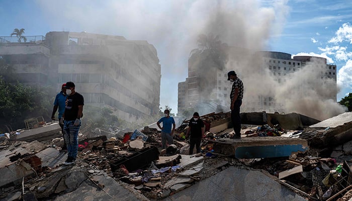 Rescuers and volunteers search for survivors in La Guaira, La Guaira state, Venezuela, on June 28, 2026, following twin earthquakes. — AFP