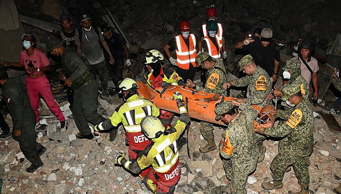 A handout photo released by the Mexican Army shows the rescue of a nine year old boy in an area struck by twin earthquakes in La Guaira state, Venezuela, on June 28, 2026. — AFP