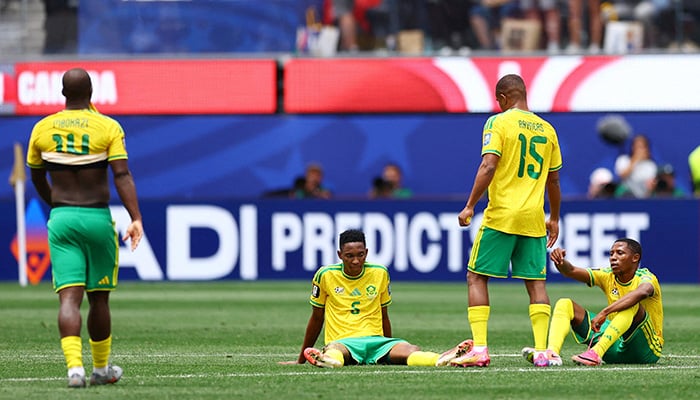 South Africas Thalente Mbatha and teammate looks dejected after the match as South Africa are eliminated from the World Cup. — Reuters/File