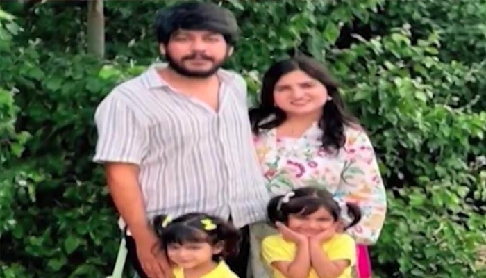 This screengrab shows Ali Murtaza, trader who was killed in a firing incident in Balochistan’s Dasht area, poses with her family. — YouTube/Geo News