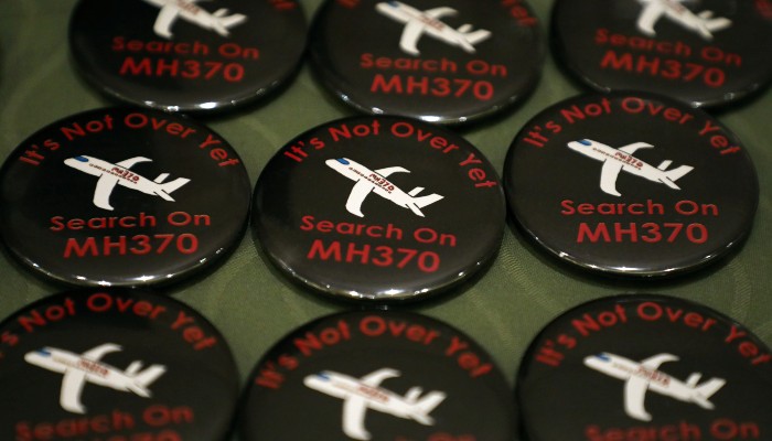 Badges are displayed during the sixth annual remembrance event for the missing Malaysia Airlines flight MH370 in Putrajaya, Malaysia, March 7, 2020. — Reuters
