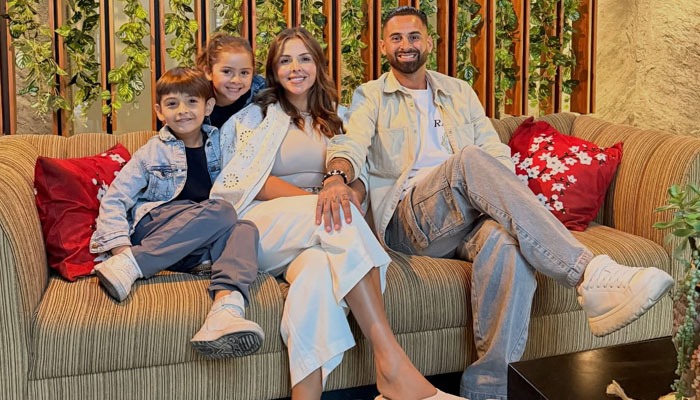 Argentine football player Lucas Trejo poses in a family photo with his wife and children. — Instagram/@Lucastrejo