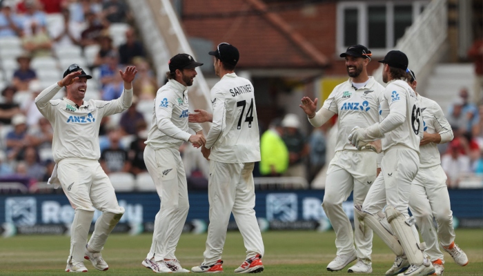 New Zealands Mitchell Santner (centre) is congratulated after running out Englands Josh Tongue on the fifth day of their third Test at Trent Bridge in Nottingham, June 29, 2026. — AFP