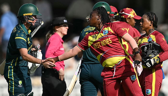 Australias players (L) shake hands with the West Indies players (R) following their victory in the ICC Womens T20 cricket world cup 2026 semi-final game between Australia and West Indies, at The Oval in London on June 30, 2026. — AFP