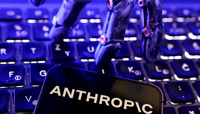 Anthropic logo, a keyboard and a robotic hand in this illustration created on June 5, 2026. — Reuters