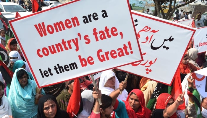 Women participate in a rally in Lahore to mark International Women’s Day in 2018. — AFP/File
