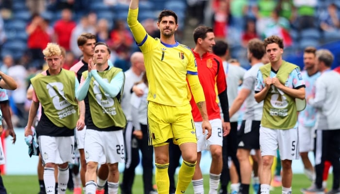 Belgiums Thibaut Courtois celebrates after the match as Belgium qualify for the Round of 16 stage of the World Cup. — Reuters
